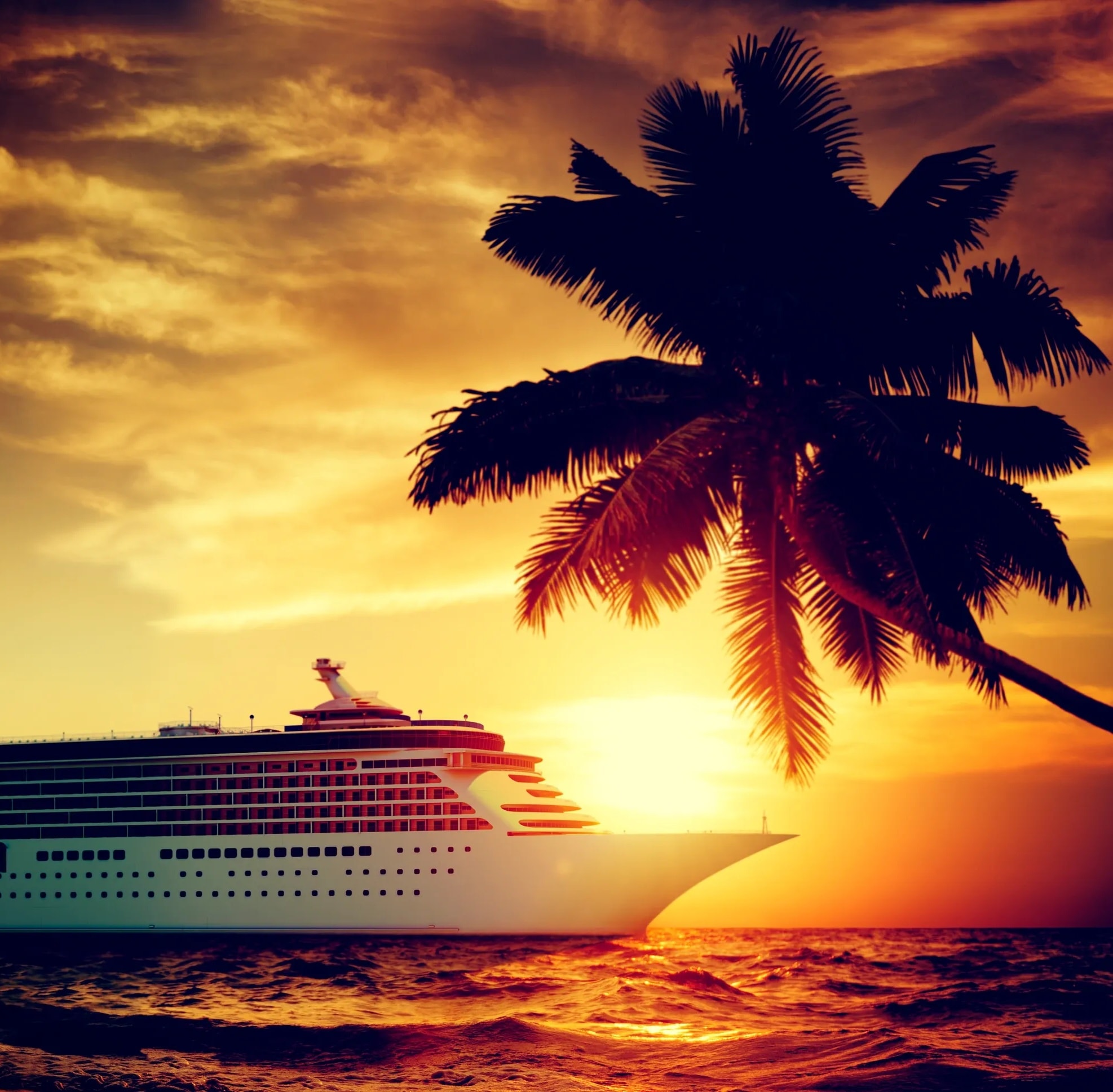 Cruise ship at tropical sunset